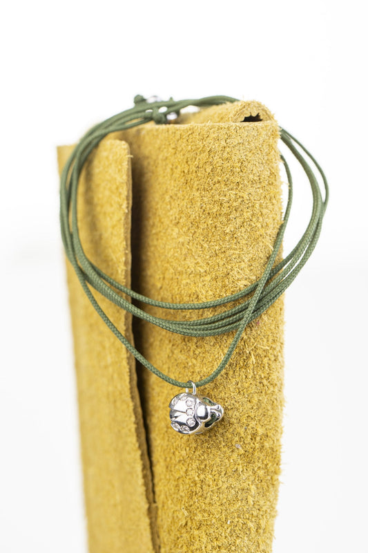 Concordia Flow Ladybird necklace, white gold on green cord